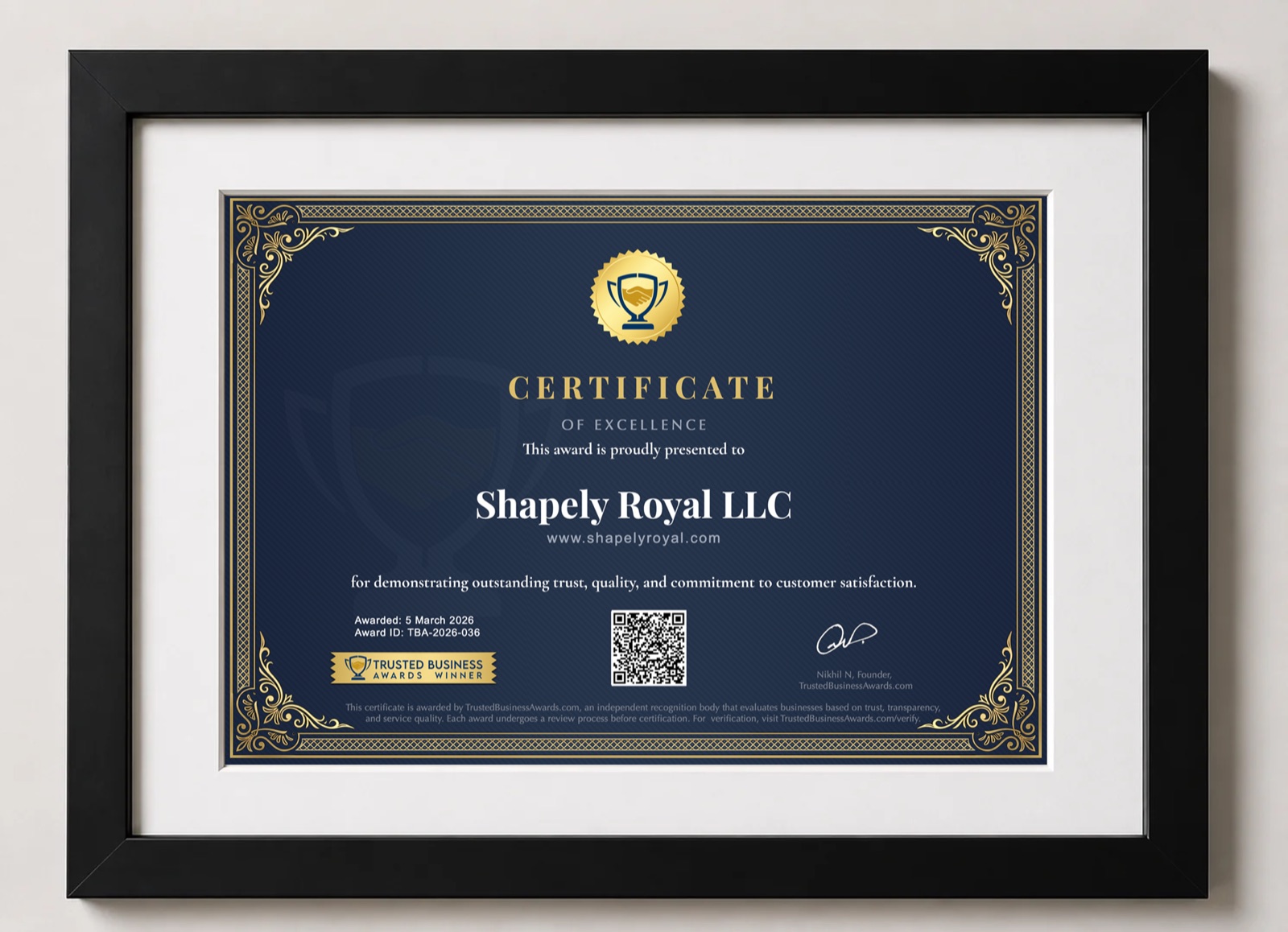 A Trusted Business Award certificate in a black frame with a white mat